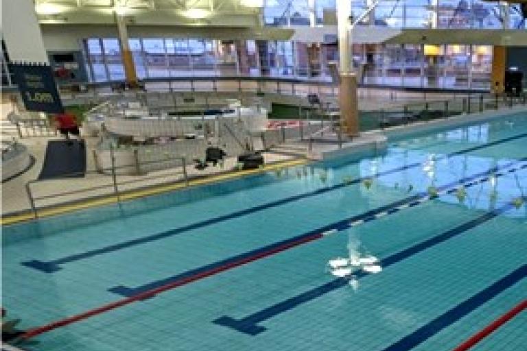 A large reflective swimming pool at East End Pool