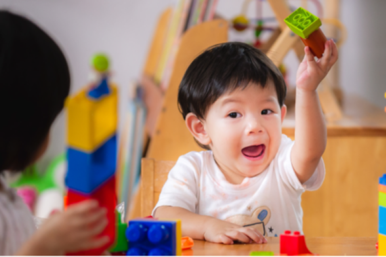 child playing with building blocks