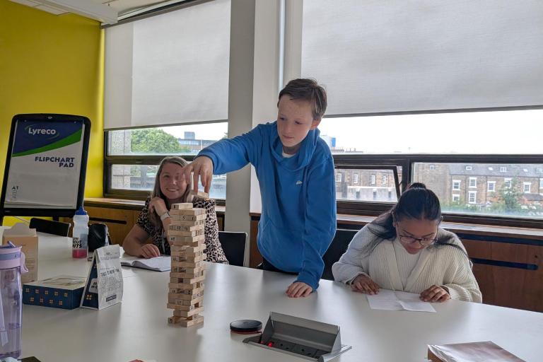 young people playing jenga 