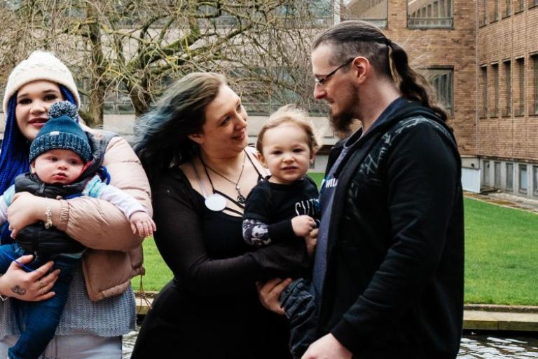Young parents with child outside the civic centre