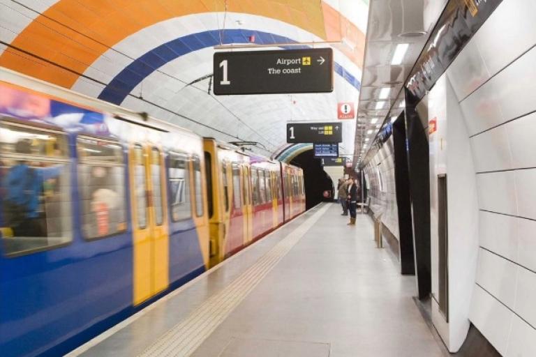 A metro train moving in an underground station 