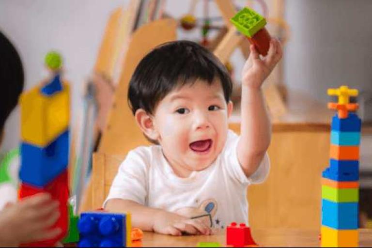 child playing with building blocks