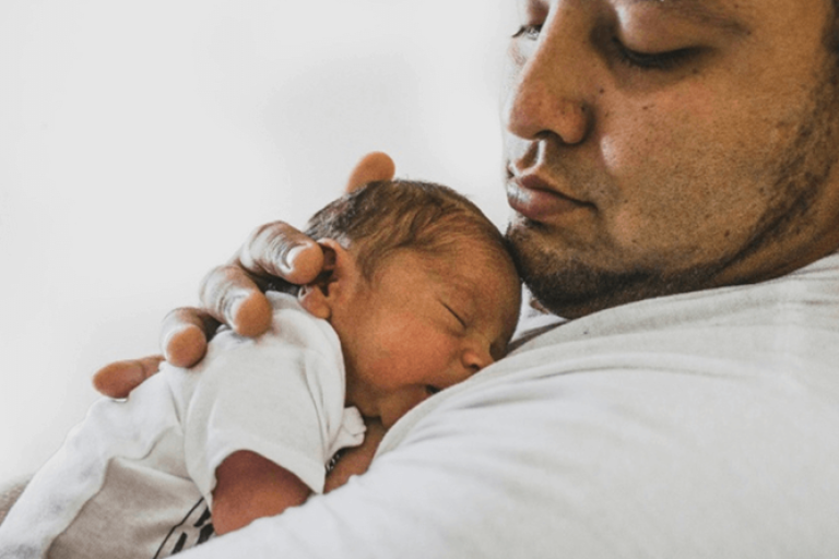 Dad holding baby 
