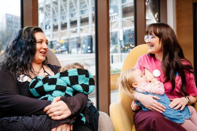 Young breastfeeding parents 