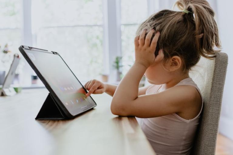 Child looking at a screen