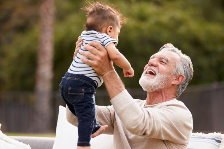 Grandfather holding baby
