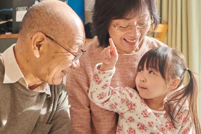 Grandparents with small child who is pointing