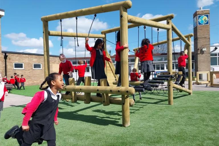 Primary children playing outdoors