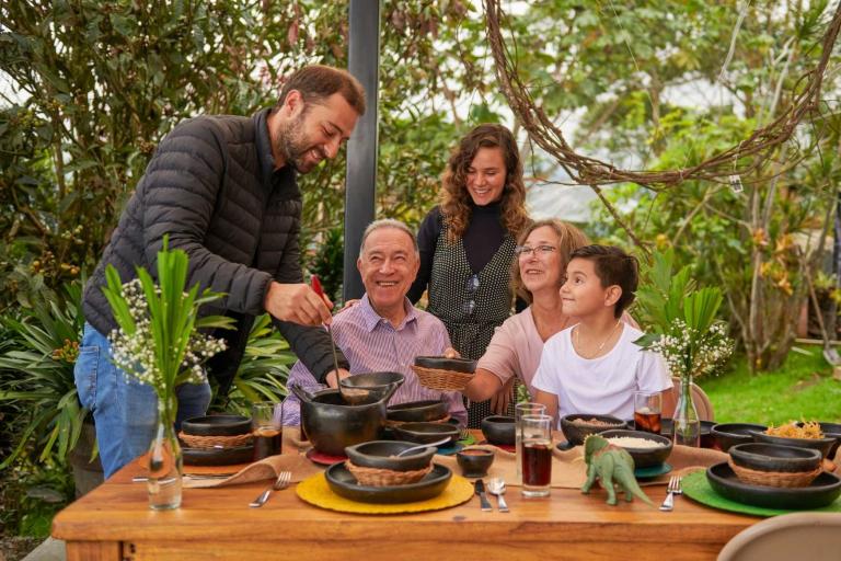 Grandparents, parents and child sharing meal time