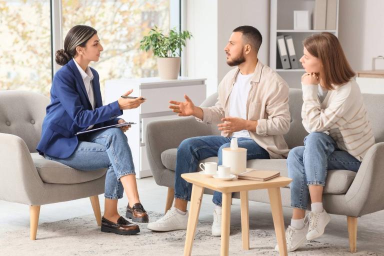 Couple sitting with professional