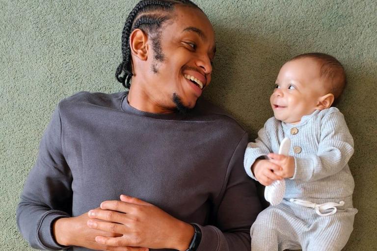Dad and baby smiling at each other