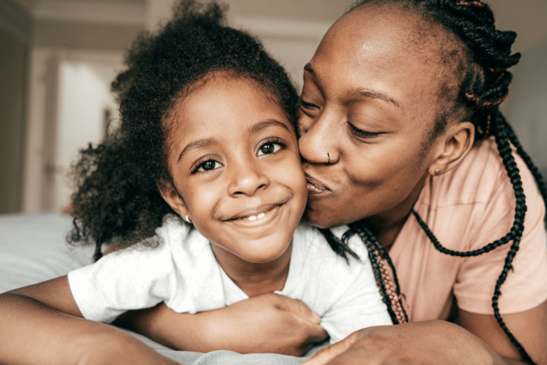 Mother and daughter smiling 