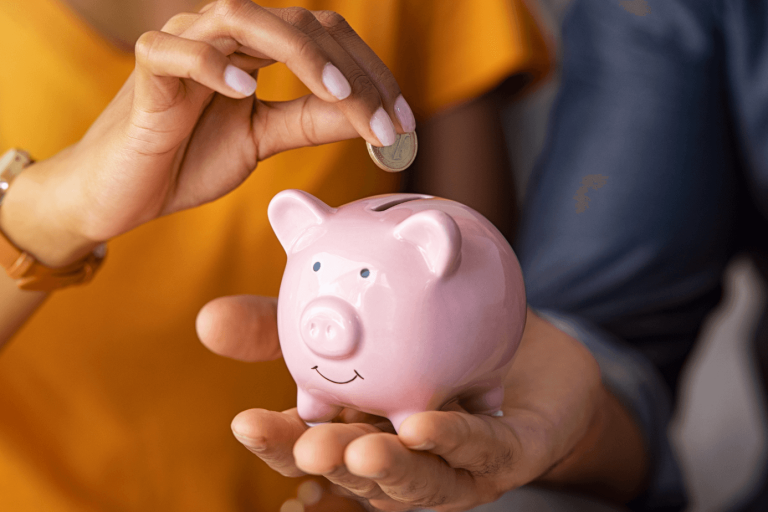 Money being put into a piggy bank