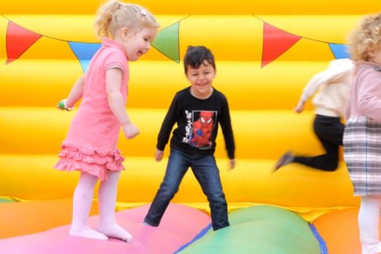 Children on a bouncy castle