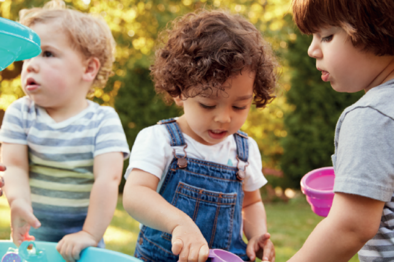Children playing with water outdoors