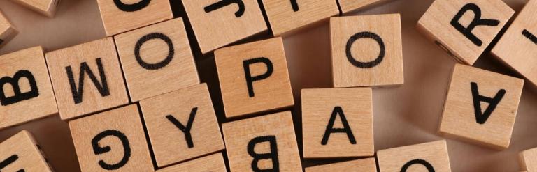 Close up wooden block with letters on them